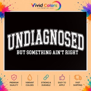 May include: A black rectangular graphic featuring the white text UNDIAGNOSED in a large, distressed, arched varsity-style font, followed by the smaller, straight white text BUT SOMETHING AIN'T RIGHT centered directly underneath the main word.