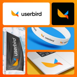 May include: A collage of Userbird branding elements. The logo features a stylized bird in orange, blue, and red. The logo appears on a white background, a black background, a flag, a wristband, and a laptop sticker. The word "userbird" is also displayed.