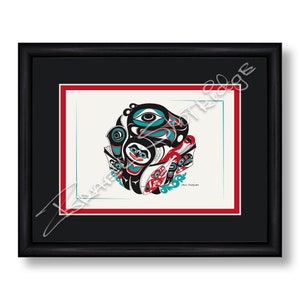May include: A framed print of a colourful Native American art piece featuring a stylised design of a bird and fish. The artwork is framed in black with a red mount.