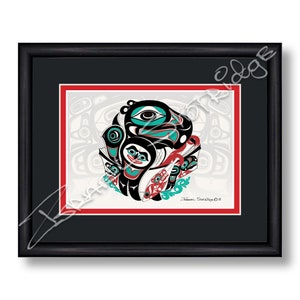 May include: A framed print of a colourful Native American art piece featuring a stylised design of a bird with a large eye, surrounded by other smaller figures. The artwork is on a white background with a red border and a black mount. The artist's signature and the year "2022" are visible in the bottom right corner.