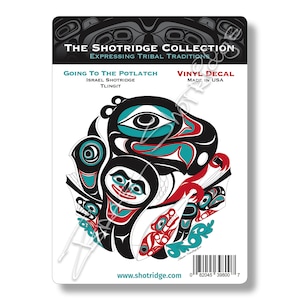 May include: A vinyl decal featuring a colourful Native American design with a black background. The design depicts a stylised animal with a red, blue, and green colour scheme. The text "Going to the Potlatch" is printed above the design, along with the artist's name, "Israel Shotridge", and the tribe, "Tlingit". The text "Vinyl Decal" and "Made in USA" are printed below the design. The text "www.shotridge.com" is printed at the bottom of the decal.