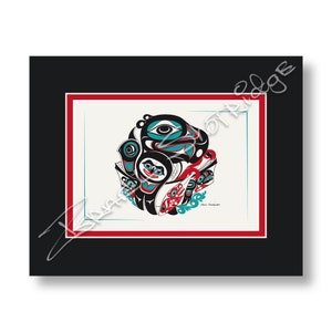 May include: A black and white print of a stylised Native American design featuring a circular pattern with a central eye and other geometric shapes. The design is in shades of black, white, blue, and red.