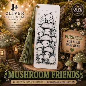 May include: A rectangular white bookmark featuring a black ink illustration of a kitten sitting atop a stack of smiling mushrooms surrounded by small flowers and hearts. The bookmark includes a green tassel attached to the top and a smooth finish.