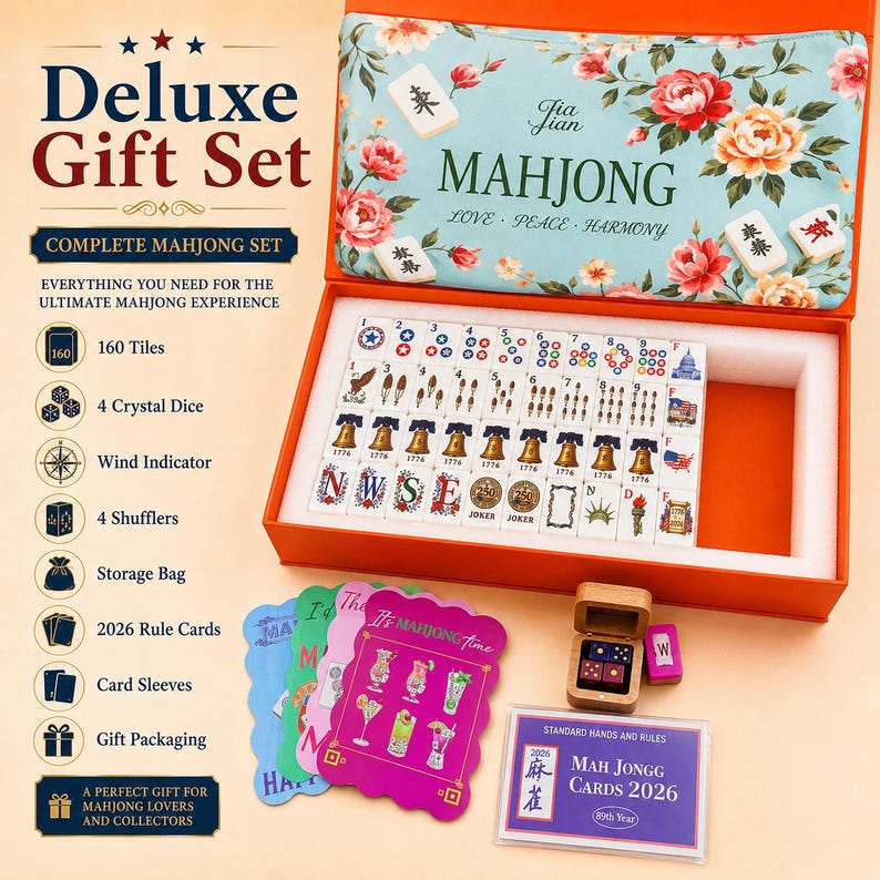 May include: A deluxe mahjong gift set in an orange box with a floral lid. The set includes 160 tiles featuring American-themed icons like bells and eagles, four crystal dice in a wooden box, 2026 rule cards, card sleeves, and a storage bag.