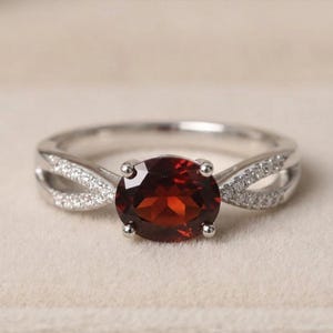 Elegant  natural garnet silver ring with a stunning ruby-red stone, perfect for adding luxury, charm, and timeless beauty to every outfit