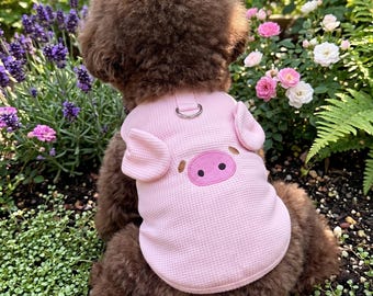 Camiseta rosa con diseño de perro y un lindo cerdito