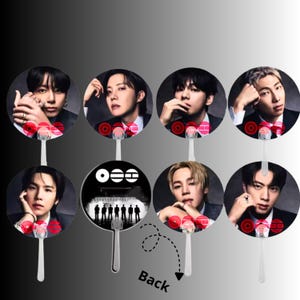 May include: A collection of eight round hand fans featuring portraits of seven individuals in dark suits and one fan displaying a group silhouette with the text symbols O, =, and H. Each fan has a white plastic handle and red circular accents.