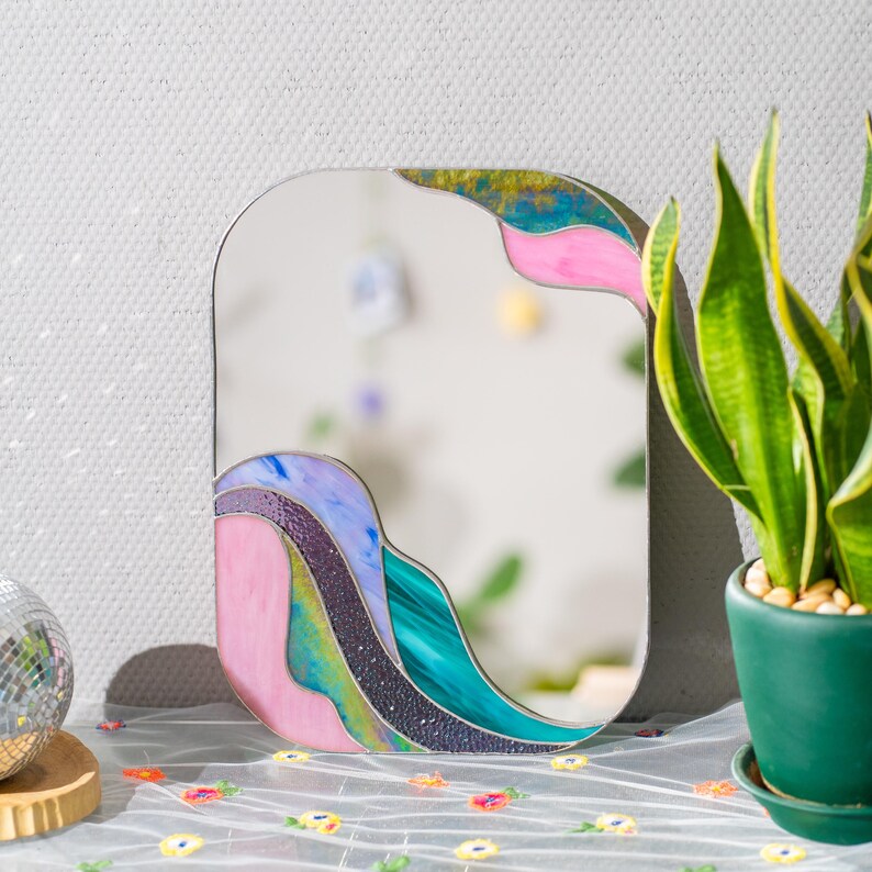 Stained glass colorful waves mirror on table with plants soft pastel glass home decor modern interior