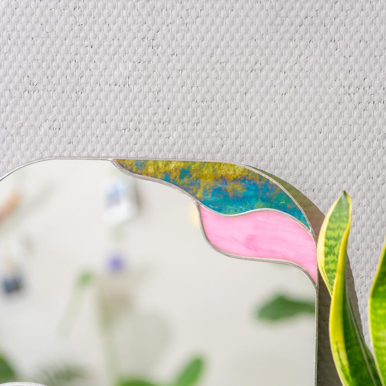 Stained glass mirror corner detail with textured glass and soft pastel colors modern handmade decor