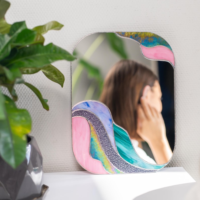 Stained glass colorful waves mirror with woman reflection lifestyle home decor aesthetic