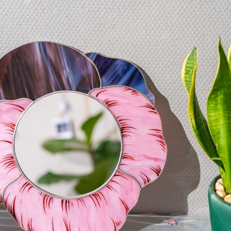 Close up stained glass pansy mirror petals with painted details and texture