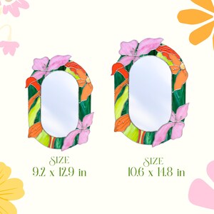 Two sizes of stained glass floral mirrors with pink flowers and green glass frame