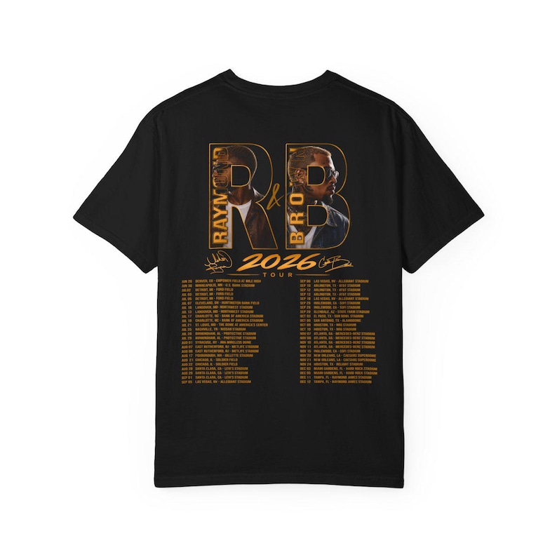 May include: A black short-sleeve t-shirt featuring a graphic on the back with the text R&B, Raymond & Brown, and 2026 Tour. The design includes two portraits of men, signatures, and a list of tour dates and stadium locations printed in gold ink.