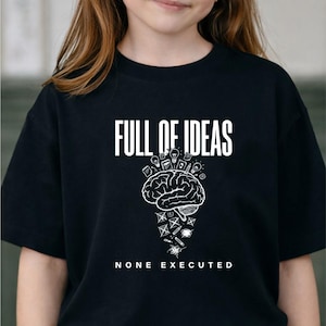 May include: Black t-shirt with the white text "FULL OF IDEAS" above a brain graphic with light bulbs and other icons. Below the brain graphic, the text reads "NONE EXECUTED".