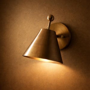 May include: A white ceramic mug with a black handle and the text "But First, Coffee" in a handwritten style. The mug is on a white surface. The mug is approximately 4 inches tall.