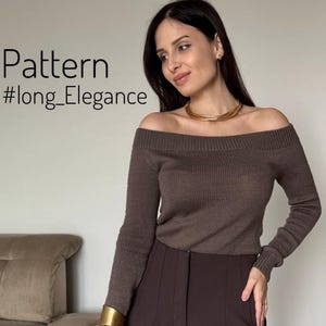 May include: A brown off-the-shoulder long-sleeve knit sweater with a ribbed neckline and cuffs, paired with dark brown trousers. The image includes the text Pattern #long_Elegance. A gold-toned multi-strand necklace and a wide gold-toned cuff bracelet.