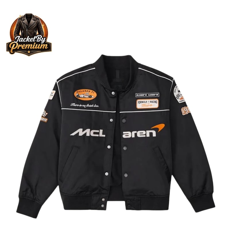 May include: Black bomber jacket with white accents and multiple patches. Features the McLaren logo and racing-themed graphics. The jacket has a button-up front and a classic bomber silhouette. The text "McLaren" and "Formula 1 Racing" are visible.