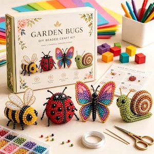 May include: A Garden Bugs DIY beaded craft kit box featuring illustrations of a bee, ladybug, butterfly, and snail. The set includes finished beaded figures of these insects, a plastic organiser with colourful beads, a spool of wire, and scissors.