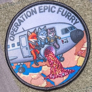 May include: A circular patch with the text "OPERATION EPIC FURRY" encircling a cartoon airplane. The plane features anthropomorphic animals, with a fox, wolf, and cat. The plane is spewing a stream of pink and red glitter.