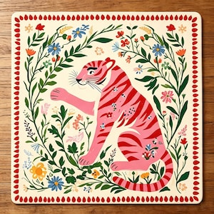 May include: A square decorative tile featuring a pink tiger with red stripes surrounded by green foliage and colourful flowers. The border consists of a repeating pattern of small red teardrop shapes on a cream-coloured background.