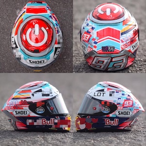 Top-down view of custom airbrushed Shoei X-15 helmet showing the full Marc Marquez MM93 graphic layout. Symmetrical hand-painted design with vibrant racing colors. Finished with premium Spies Hecker automotive clear coat. Luxury custom helmet for MotoGP fans, featuring authentic Shoei X-Fifteen AIM+ 6-layer shell construction. High-performance airflow vents integrated into the custom design. Elite collectible item for motorcycle helmet enthusiasts.