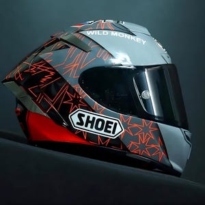 Side view detail of custom airbrushed Shoei X-15 Marc Marquez edition showing intricate Red Bull and MM93 graphics. Authentic Shoei X-Fifteen CWR-F2R racing shield system. Hand-painted by professional airbrush artists using premium automotive paint and Spies Hecker industrial clear coat for maximum durability. Targeted at premium motorcycle gear collectors in Australia and USA. High-end custom automotive art with 4-week precision craftsmanship.