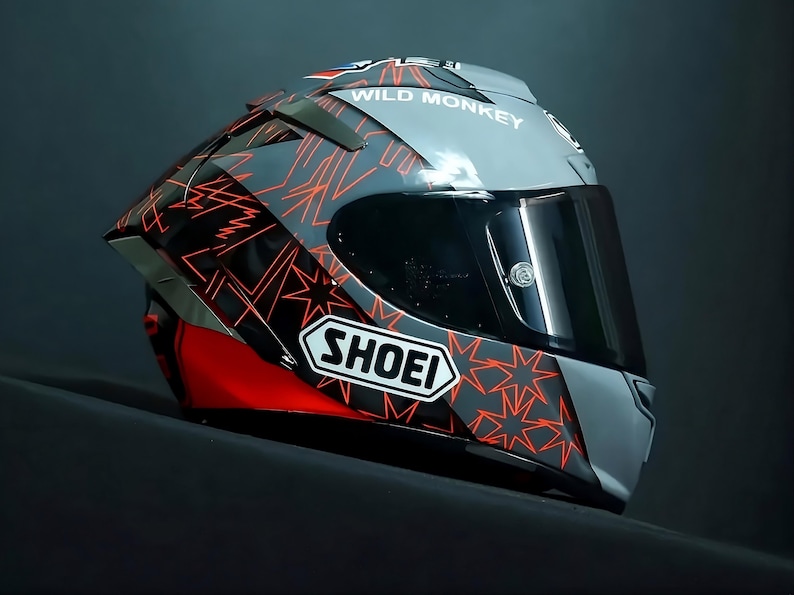 Side view detail of custom airbrushed Shoei X-15 Marc Marquez edition showing intricate Red Bull and MM93 graphics. Authentic Shoei X-Fifteen CWR-F2R racing shield system. Hand-painted by professional airbrush artists using premium automotive paint and Spies Hecker industrial clear coat for maximum durability. Targeted at premium motorcycle gear collectors in Australia and USA. High-end custom automotive art with 4-week precision craftsmanship.