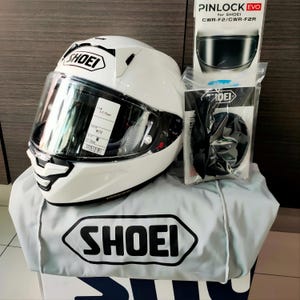 Original 100% authentic Shoei X-Fifteen (X-15) helmet in factory base color before custom airbrushing. Showcasing the genuine AIM+ shell construction, CWR-F2R racing visor, and factory safety stickers. We use only brand new, genuine Shoei X-15 helmets as the canvas for our premium airbrush projects. Guaranteed authenticity for buyers in Australia and USA seeking high-performance safety combined with bespoke professional paintwork.
