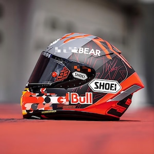 Premium custom airbrush Shoei X-15 Marc Marquez helmet in a sophisticated matte finish with Spies Hecker specialized coating. Stealthy MotoGP racing look for superbike and street riders. Authentic Shoei X-Fifteen shell with bespoke hand-painted MM93 graphics. Targeted at motorcycle enthusiasts in the UK and USA looking for unique, high-end custom gear. Professional automotive durability and world-class detail for helmet collectors.