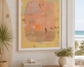 May include: A framed wall art print featuring a yellow background with the text RIDE THE WAVE in blue. The illustration includes palm trees, a sun, horses, and handwritten notes that read MAYBE THIS IS WHERE IT STARTS and BONFIRE CLEAN LINES OUTDOORS SHOWER SUNSETS.