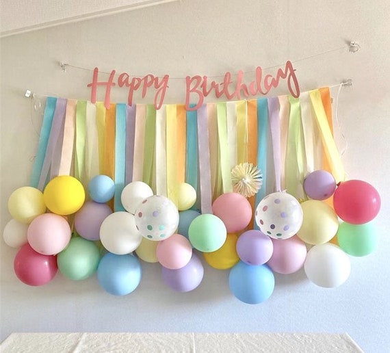 Colorful birthday party decorations with balloons and streamers creating a magical celebration atmosphere
