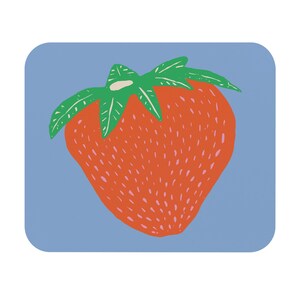 May include: A square coaster with a stylized illustration of a strawberry. The strawberry is red with small pink seeds and green leaves. The background is a light blue color.