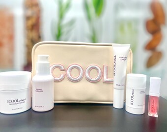 Kit di bellezza per la cura personale: detergente, crema idratante, lozione, olio per labbra, stick per lo styling.