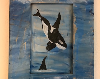 Orcas on distessed wood cabinet