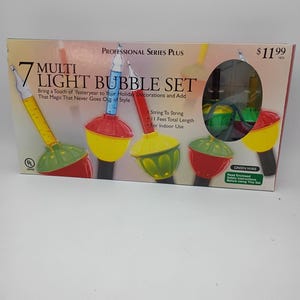 May include: A box set of 7 multi-colored bubble lights. The box reads "7 Multi Light Bubble Set" and "Bring a Touch of Yesteryear to Your Holiday Decorations and Add That Magic That Never Goes Out of Style". The lights are for indoor use.