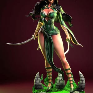May include: A detailed figurine of a woman in a green and gold fantasy outfit, holding two curved blades. The figure has long dark hair and is standing on a stone base with green accents. The Sigma One logo is visible.