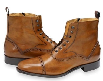 Handmade men's tan brown leather lace-up ankle boots with decorative wingtip brogue perforations,