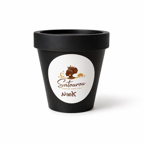 Loose Naak incense powder made from natural Senegalese aromatics, shown in a small mound on a neutral background with its fine earthy texture visible.