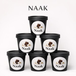 Loose Naak incense powder made from natural Senegalese aromatics, shown in a small mound on a neutral background with its fine earthy texture visible.