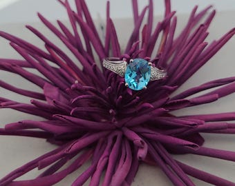 Sterling Silver Ring for Women with Oval Blue Topaz and accent CZ