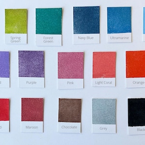 May include: Color chart with 18 paint swatches, each with a name label. The colors include emerald green, spring green, forest green, navy blue, ultramarine, powder blue, orchid, purple, pink, light coral, orange, red, maroon, chocolate, grey, and black.