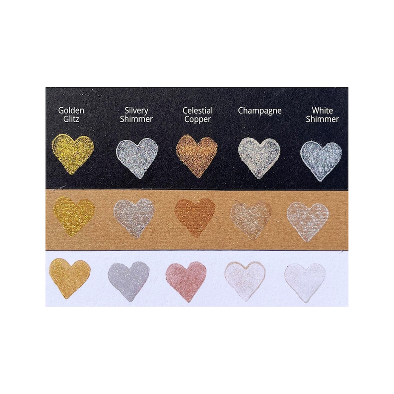 May include: A comparison of different metallic paint colors in heart shapes. The colors are Golden Glitz, Silvery Shimmer, Celestial Copper, Champagne, and White Shimmer.