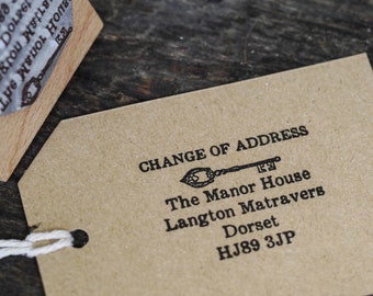May include: A change of address card with a key design. The text reads "Change of Address", "The Manor House", "Langton Matravers", "Dorset", and "HJ89 3JP".