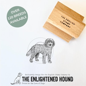 May include: A black and white illustration of a dog with the text "The Enlightened Hound" and "Prints for the Love of Dogs" below. The text "Over 120 Breeds Available" is in a circle in the top left corner. A wooden stamp with the text "The English Stamp Company" is in the top right corner.