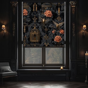May include: A dark room with a window featuring a decorative roller shade. The shade displays a pattern of roses, birds, and ornate cages in shades of black, gold, and orange. The room has dark wood paneling and gold accents.