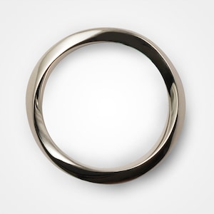 May include: A silver ring with a twisted design.