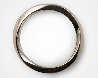 May include: A silver ring with a twisted design.
