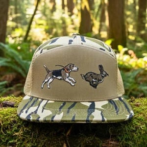 May include: A handmade, wooden serving tray with a natural finish. The tray features a rectangular shape with rounded corners and two carved handles. The wood grain is visible, adding to its rustic charm. Dimensions are approximately 16 inches long and 10 inches wide.