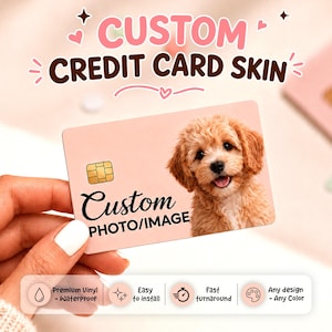 May include: A custom credit card skin with a photo of a fluffy, light brown dog. The card is pink with the words "CUSTOM CREDIT CARD SKIN" at the top. The card also says "Custom PHOTO/IMAGE". Features include waterproof, easy to install, fast turnaround, and any design or color.