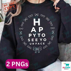 May include: Black sweatshirt with a white graphic. The graphic features the words "HAPPY TO SEE YOUR FACE" in a circular design with eyeglasses and bow ties. The words are arranged like an eye chart.